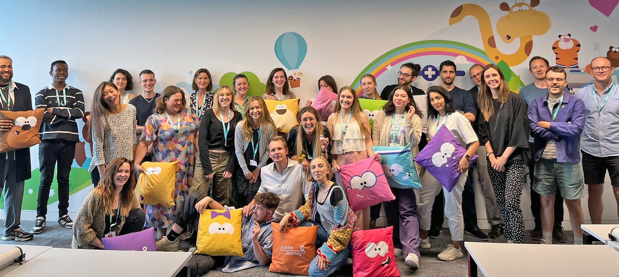 A photo of the Little Journey team all together in an office. 